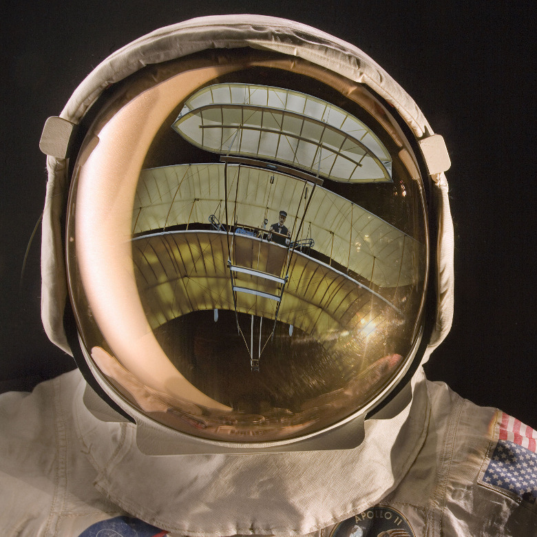 Apollo helmet visor reflecting the 1903 Wright Flyer / National Air and Space Museum, Smithsonian Institution / Bridgeman Images