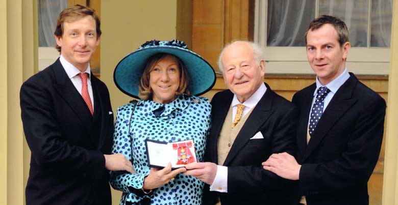 Harriet Bridgeman, her husband Robin and their sons Luke and Esmond at the Investiture ceremony, Buckingham Palace, 4 March 2014.
