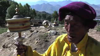 Old man with prayer wheel, Tibet 1